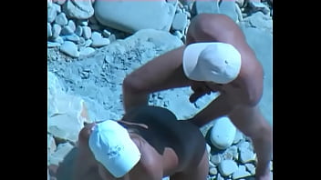 Amateur tan milf fucking on the rocks