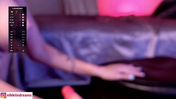 Whore rams a dildo in her ass