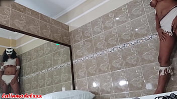 Big tits model gets ready for sexy photoshoot in tiny costume