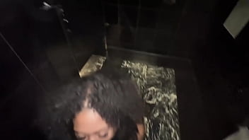 Horny brunette swallows my cock in a hotel bathroom