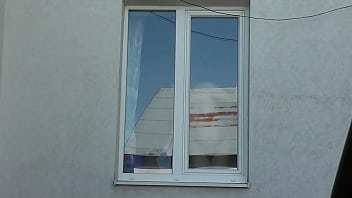 Nude woman neighbor sexy mature milf without panties and bra washes windows her apartment a taxi driver watches from car solo naked in public peeping outdoor outside publicly big natural tits pussy