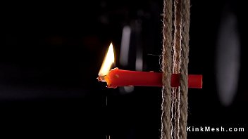 Hogtied brunette caned and fingered