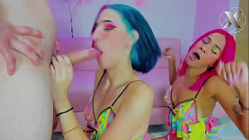 Two beautiful girls with colorful hair fuck his throat