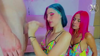 Two beautiful girls with colorful hair fuck his throat