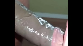 Slut swallowing a big black dick deep down her throat