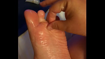 Rubbing Lotion On My Foot thumbnail