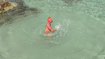 Pink bikini in a beautiful bay