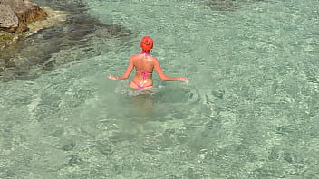 Pink bikini in a beautiful bay