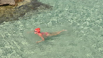 Pink bikini in a beautiful bay
