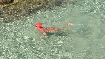 Pink bikini in a beautiful bay