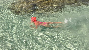 Pink bikini in a beautiful bay