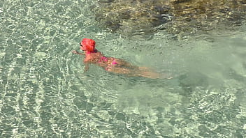Pink bikini in a beautiful bay
