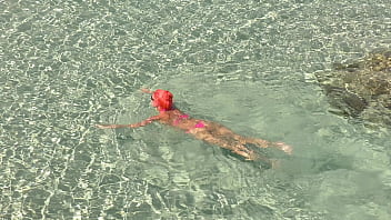 Pink bikini in a beautiful bay