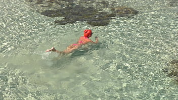 Pink bikini in a beautiful bay