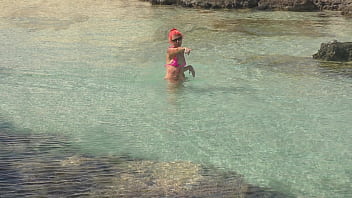 Pink bikini in a beautiful bay