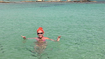 Pink bikini in a beautiful bay