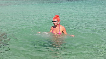 Pink bikini in a beautiful bay