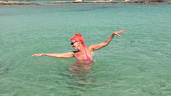Pink bikini in a beautiful bay