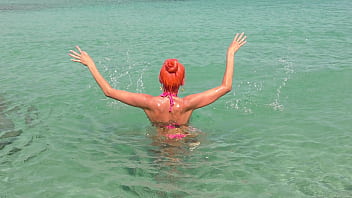Pink bikini in a beautiful bay