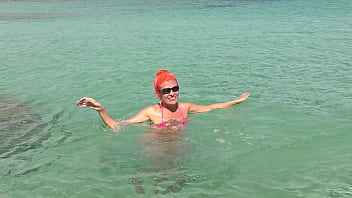 Pink bikini in a beautiful bay