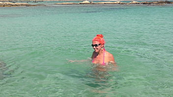 Pink bikini in a beautiful bay