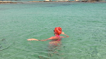 Pink bikini in a beautiful bay