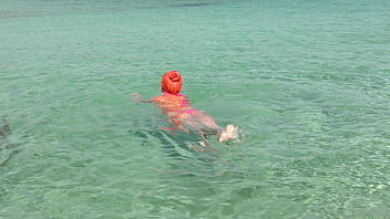 Pink bikini in a beautiful bay