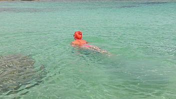 Pink bikini in a beautiful bay