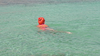 Pink bikini in a beautiful bay