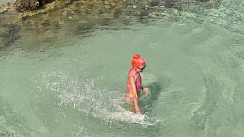 Pink bikini in a beautiful bay