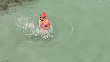 Pink bikini in a beautiful bay
