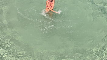 Pink bikini in a beautiful bay