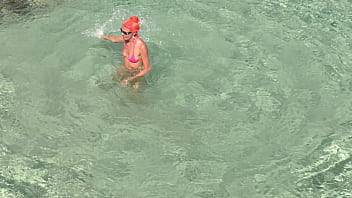 Pink bikini in a beautiful bay