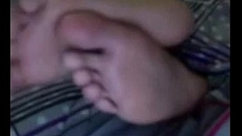 Cute latina teasing her feet and soles