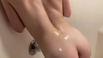 Sexy skinny teen plays with her pussy in the shower