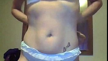 Slutty milf strips and finger fucks her holes