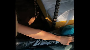 Woman in fetish gear showing off in window