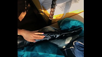 Woman in fetish gear showing off in window