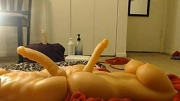 Busty playing with two dildos