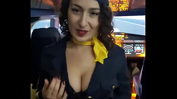 The flight attendant puts a dildo in her pussy on board
