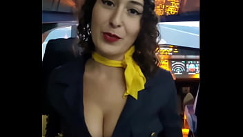 The flight attendant puts a dildo in her pussy on board