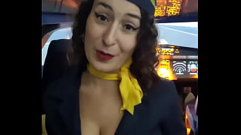 The flight attendant puts a dildo in her pussy on board