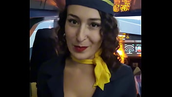 The flight attendant puts a dildo in her pussy on board
