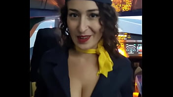 The flight attendant puts a dildo in her pussy on board