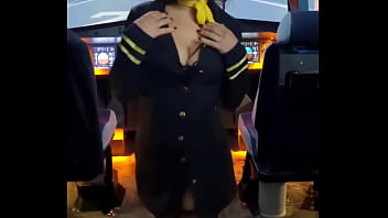 The flight attendant puts a dildo in her pussy on board