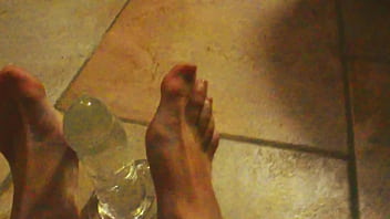 Ariel ortiz plays with her feet with her toy