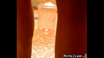 Busty shows her tits in her house