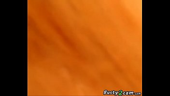 Busty shows her tits in her house