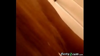 Busty shows her tits in her house