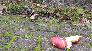 Woman crush apple underfeet